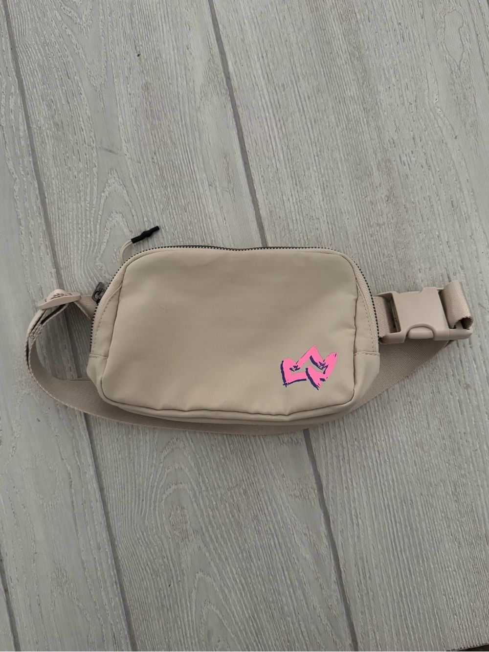 beige Primal Queen belt bag with a pink logo, Fanny pack, travel, crossbody
